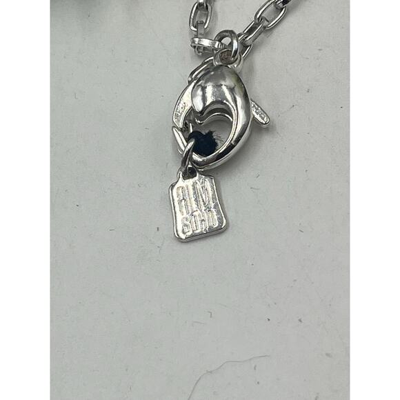 Robert Lee Morris RLM SOHO faux Turquoise Silvertone wrap chunk
Pendant Necklace - Picture 3 of 7